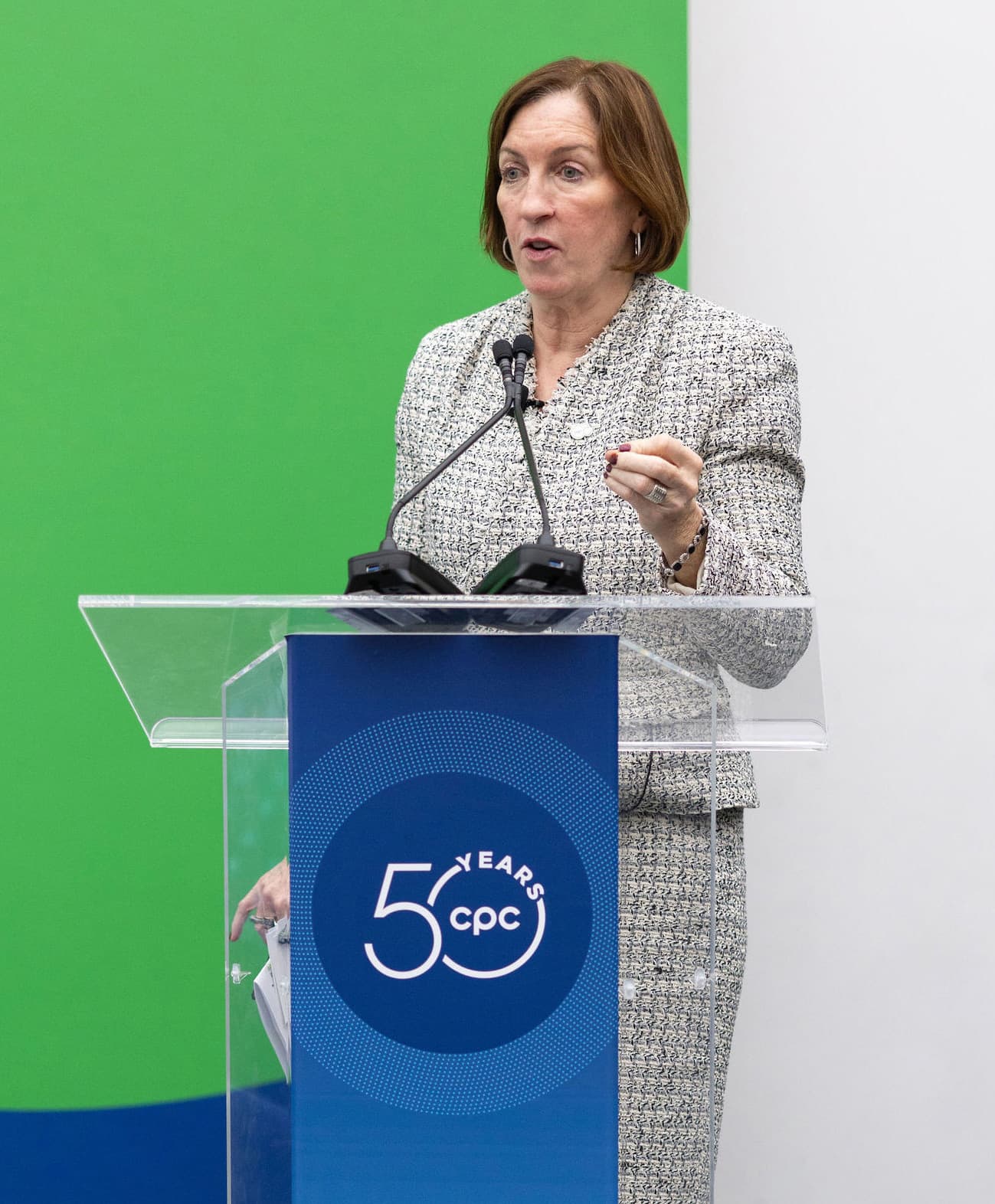 Sadie at podium which reads '50 years cpc'.