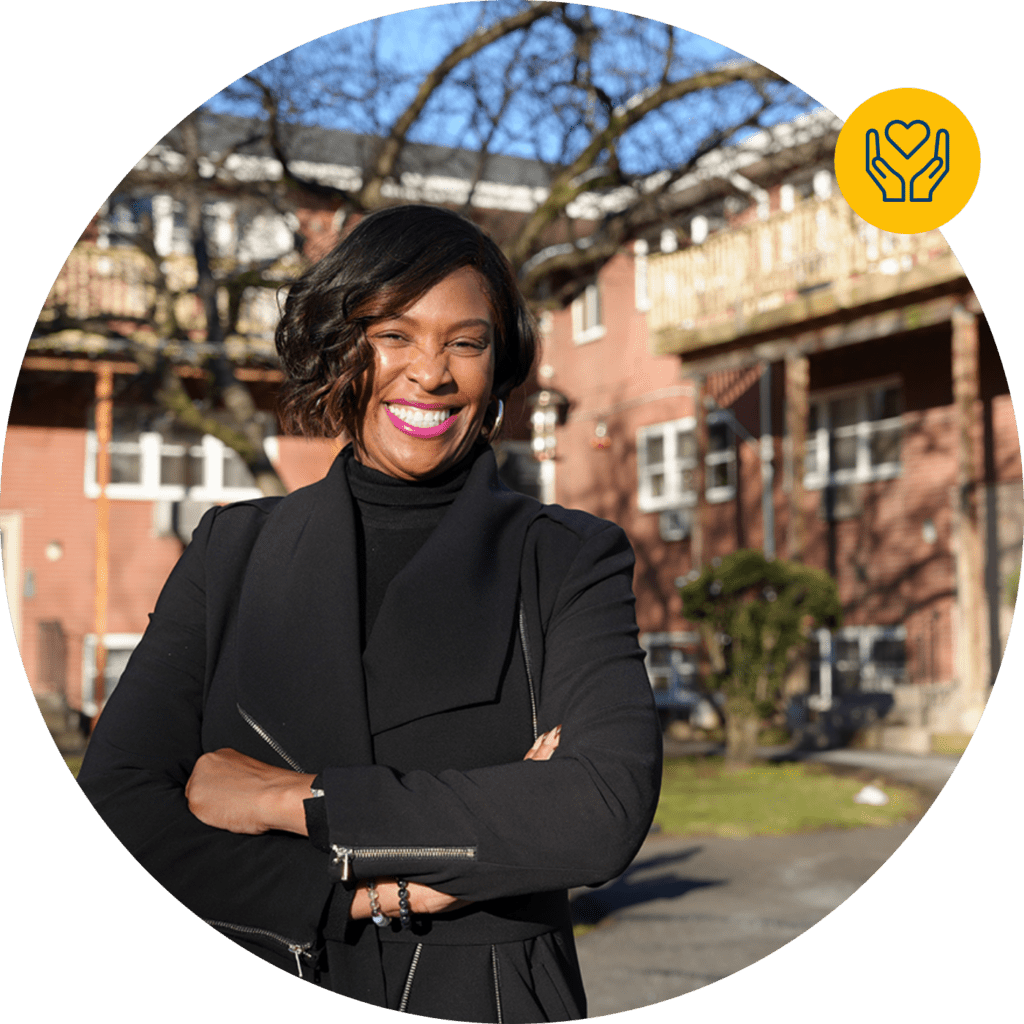 Yolanda Barham stands in front of her home, a co-op building that CPC helped preserve, renovate, and stabilize after systemic fraud put the affordable property in financial distress, through no fault of its residents.  