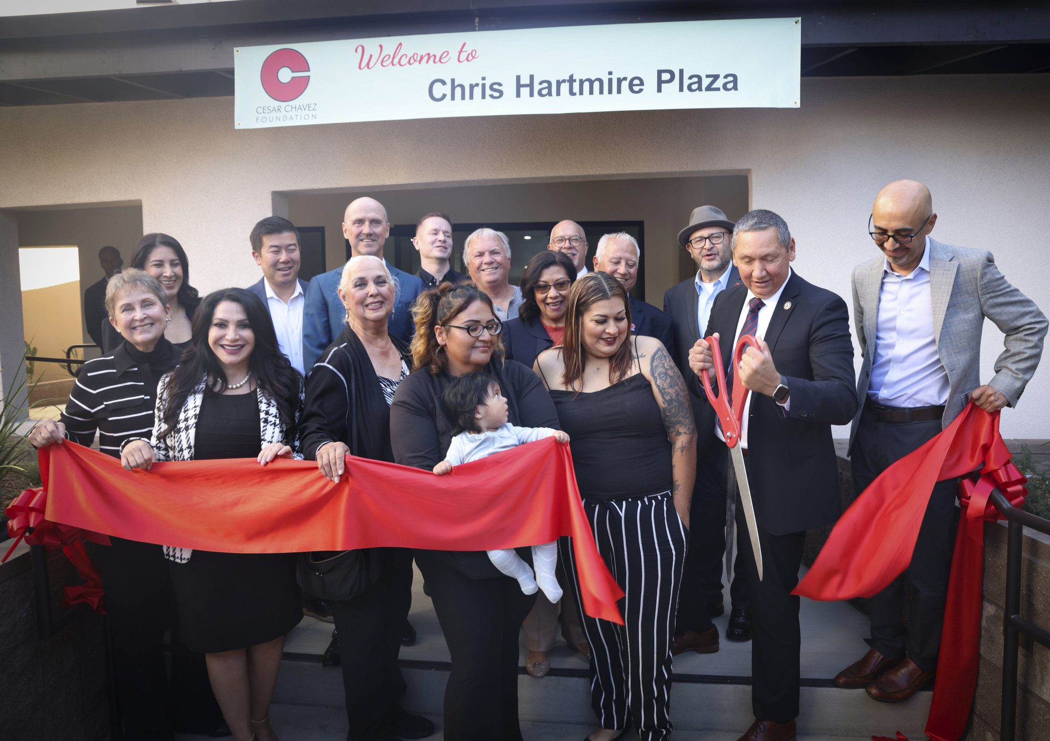 Residents and community leaders cut the ribbon for Chris Hartmire Plaza in Pomona, Calif., on Oct. 21, 2025.